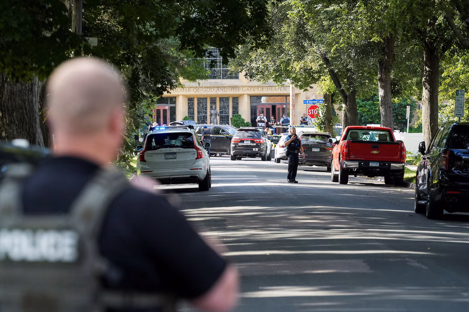 Law enforcement officers gather outside Annunciation Church following a mass shooting event, in Minneapolis, Minnesota, August 27, 2025. Tim Evans/Reuters