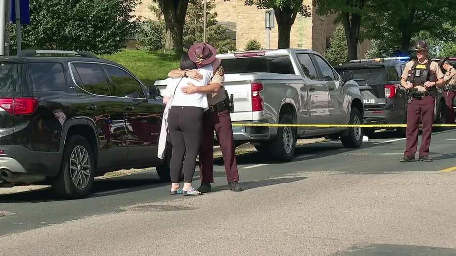 Law enforcement officers gather outside Annunciation Church following a mass shooting event, in Minneapolis, Minnesota, August 27, 2025. Tim Evans/Reuters