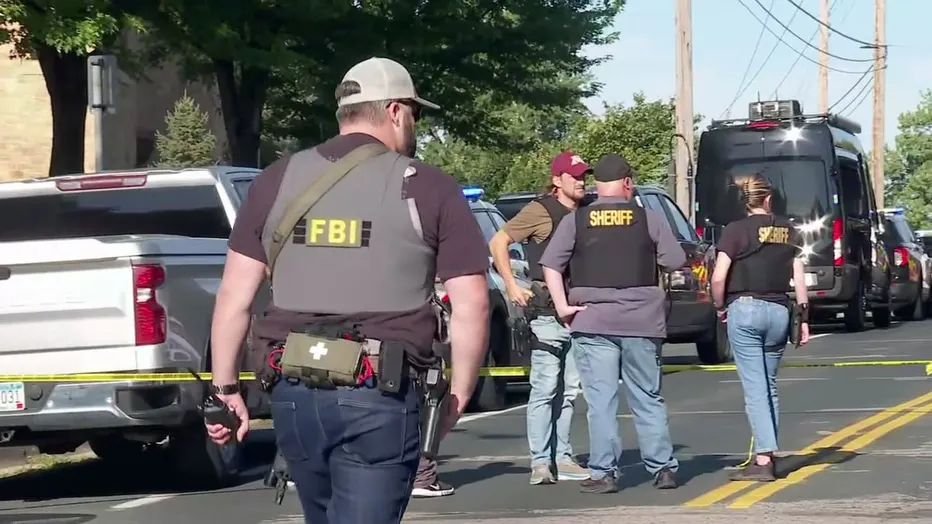 Law enforcement officers gather outside Annunciation Church following a mass shooting event, in Minneapolis, Minnesota, August 27, 2025. Tim Evans/Reuters