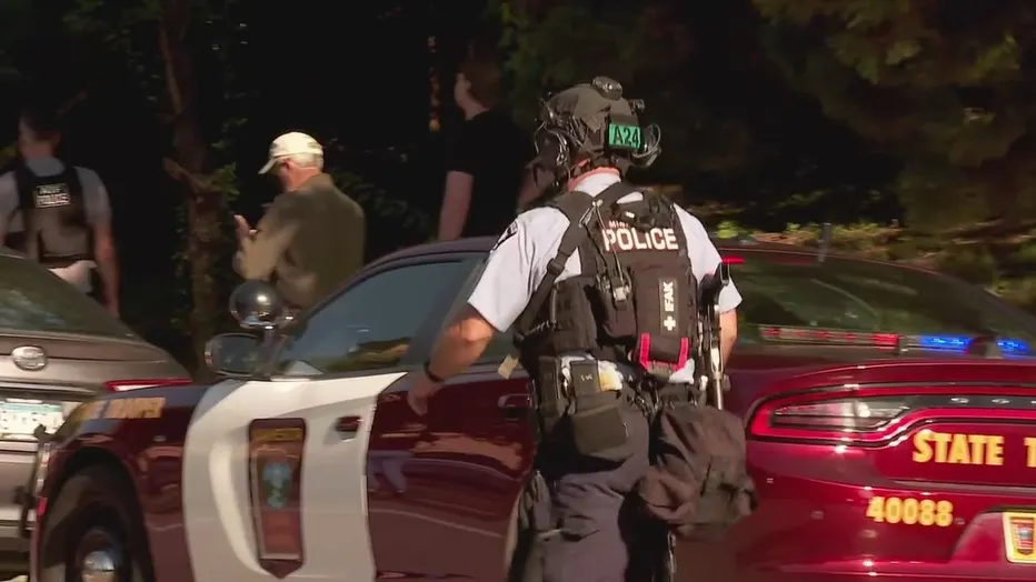 Law enforcement officers gather outside Annunciation Church following a mass shooting event, in Minneapolis, Minnesota, August 27, 2025. Tim Evans/Reuters