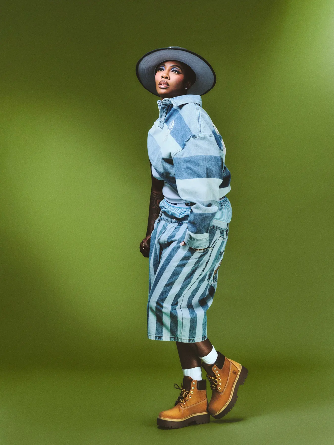 Tiwa Savage wears Stone Street 6-inch boots in wheat by TIMBERLAND, shirt, shorts and briefs by BBC ICE CREAM, hat by MAURICE HATS and earrings by H&M and rings by NEXT