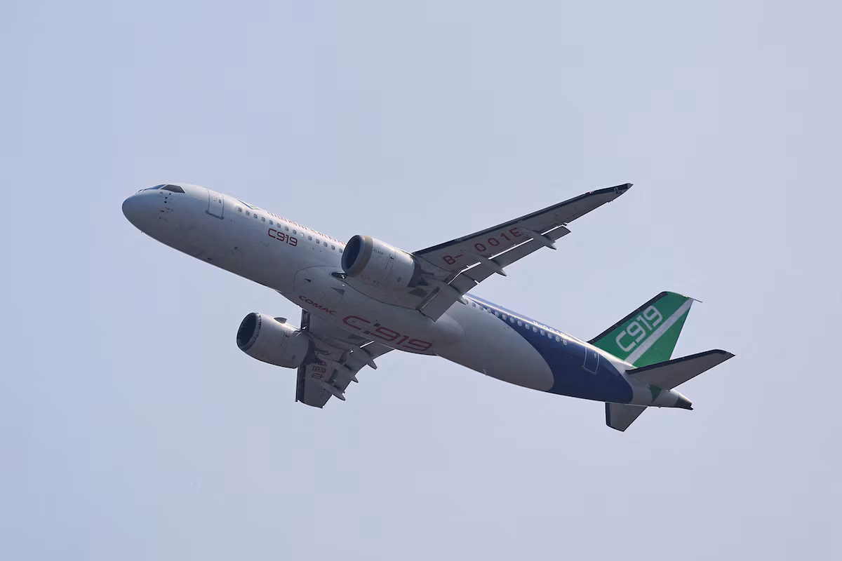 A COMAC C919 narrowbody airliner flies in the sky at the China International Aviation and Aerospace Exhibition, or Airshow China, in Zhuhai, Guangdong province, China November 12, 2024.