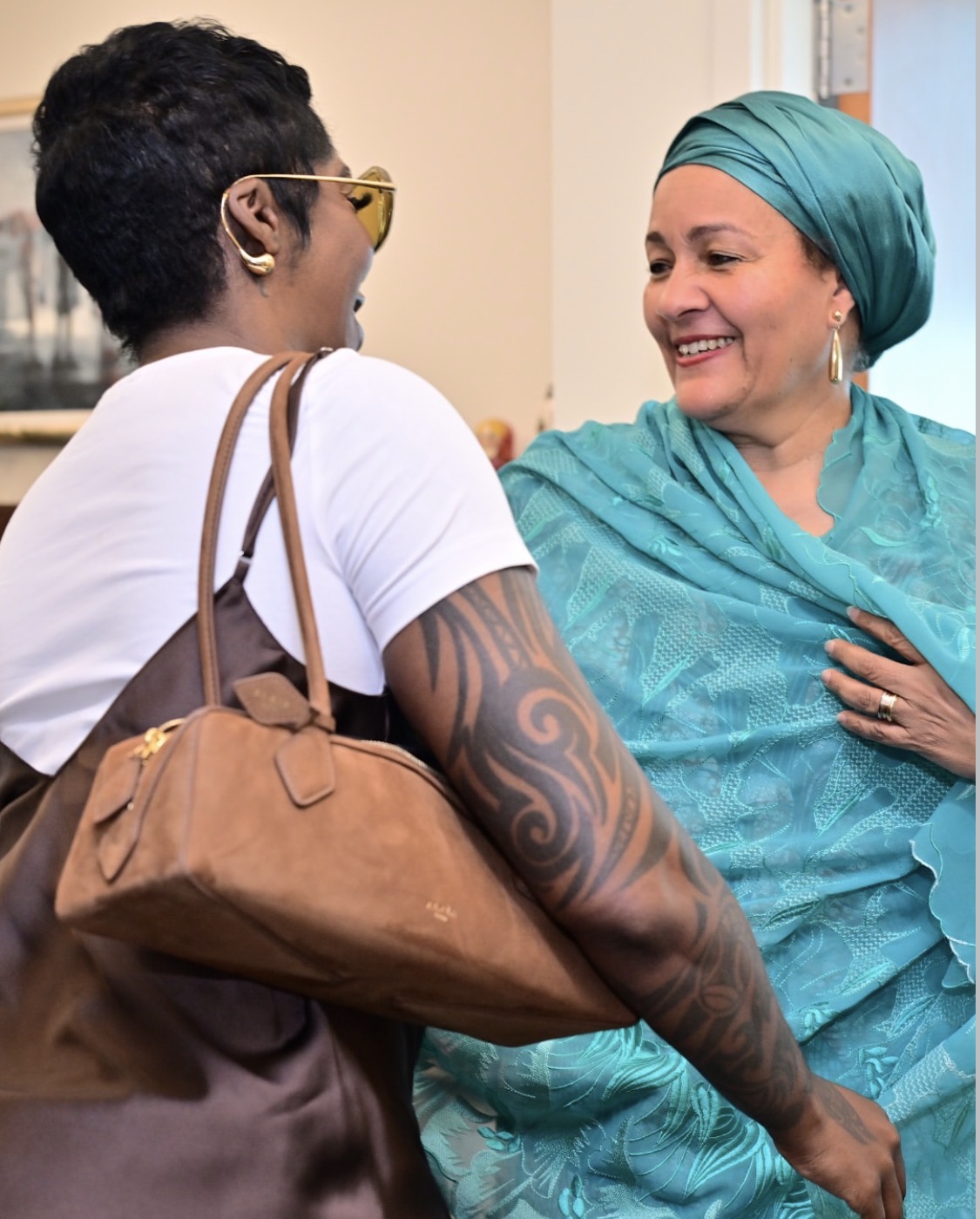 Tiwa Savage and Amina J. Mohammed at the United Nations Headquarters in New York.